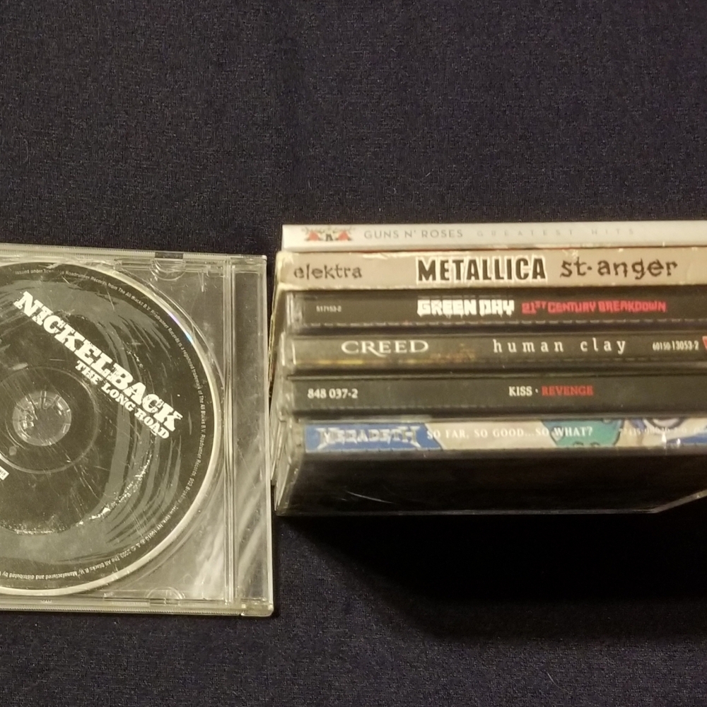 7 rock cds: Metallica, Guns N Roses, KISS, Creed, and more!